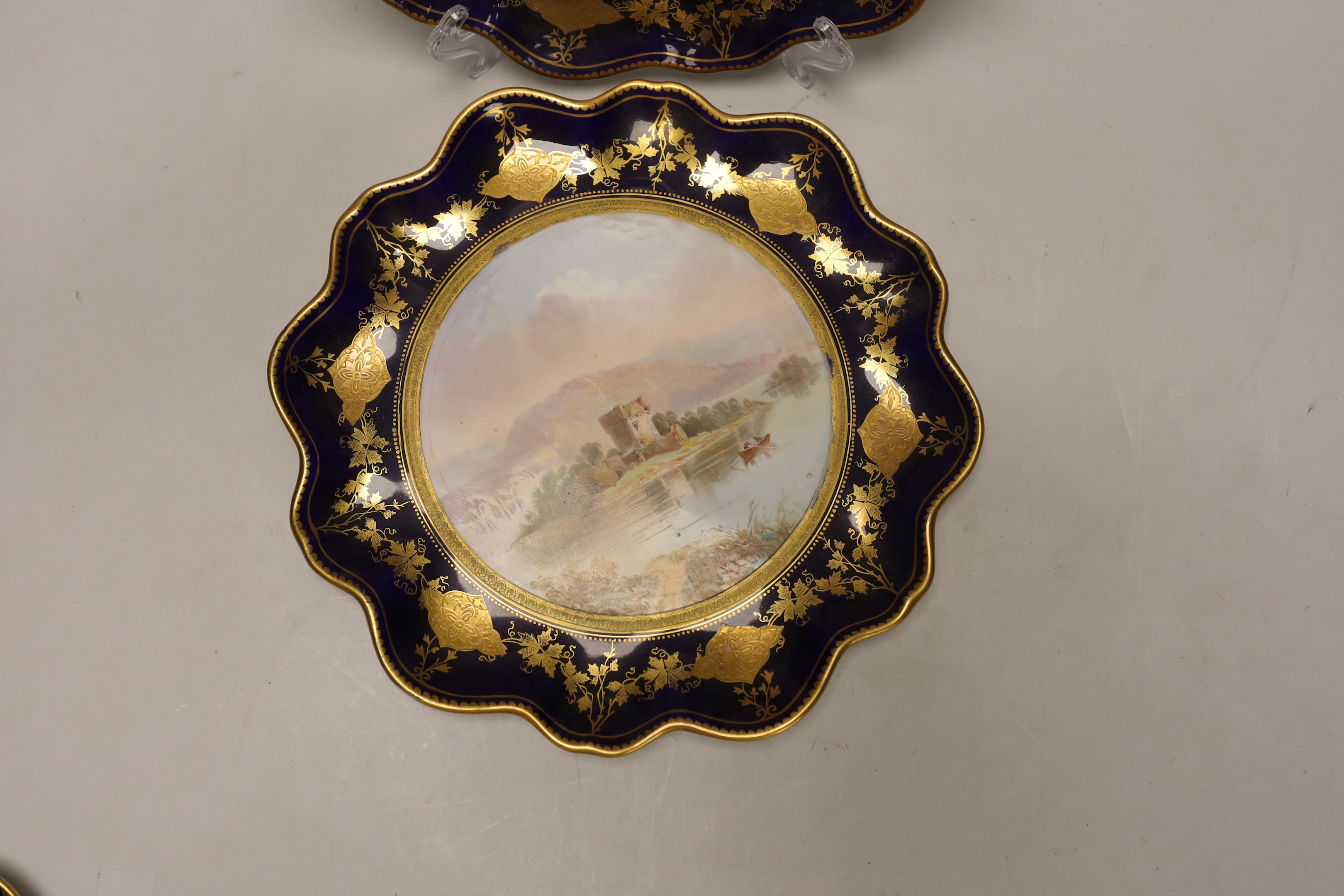 A set of four Victorian bone china cabinet plates, each painted with a named view by J Birbeck